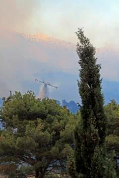 Canadair gasing the fire Stock Photos