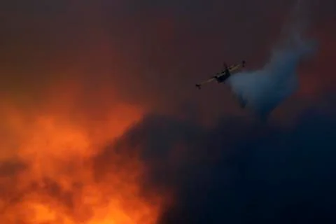 Canadair gasing the fire Stock Photos