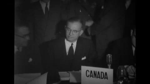 Canadian delegates sitting at a table at Nato Conference Stock Footage 36424831