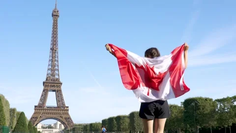 Canadian flag and the Eiffel Tower Stock Footage 249202111