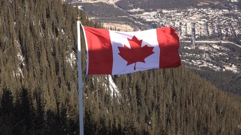 Canadian flag with Banff in background 4... | Stock Video | Pond5