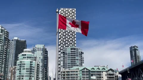 Canadian flag flapping in the wind in Vancouver Granville Islans, sunny day Stock Footage 271317615