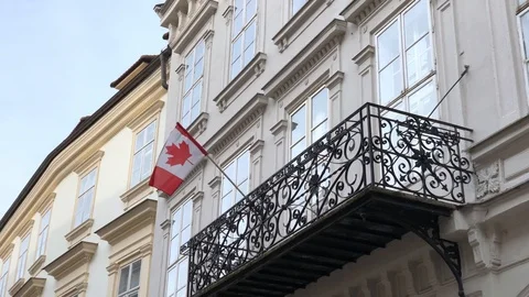 Canadian flag waving in the wind on the building in Bratislava Stock Footage 86293076