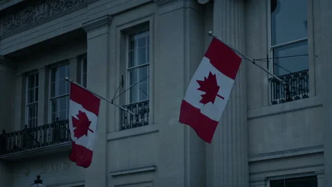 Canadian Flags On Building In The Evening Vídeos de archivo 153423592