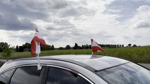 Canadian flags on car Stock Footage 272834459
