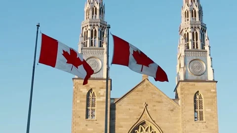 Canadian flags in front of the Notre-Dame Cathedral Basilica in Ottawa, Canada Video stock 155935262