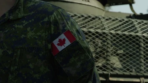 Canadian forces patch in front of tank Stock Footage 70568659