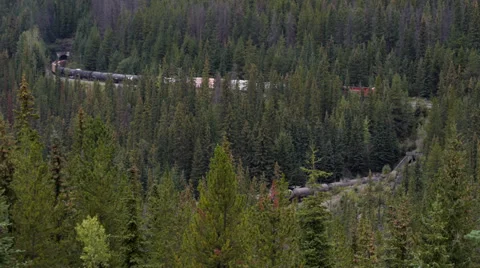 Canadian Pacific Train Passes Over Itself at Lower Spiral Tunnel Stock Footage 31866252