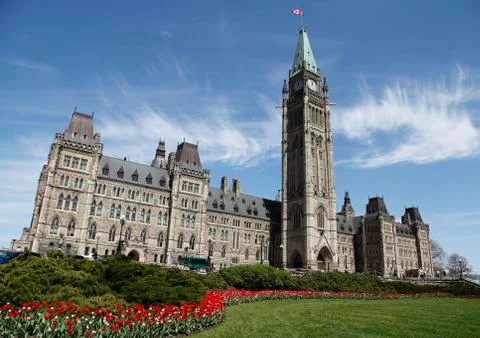 Canadian Parliament Centre Block Building With Springtime Tulips Stock Photos