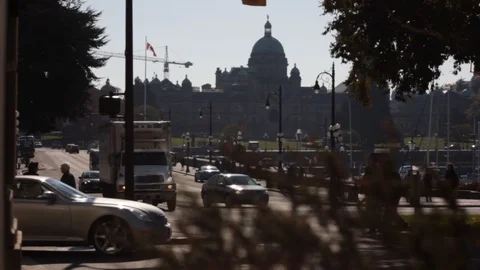 Canadian Parliament in Victoria BC with passing cars and people Stock Footage