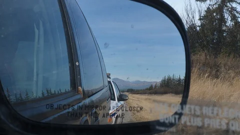 Canadian Police Car Pull over Tourist Side Mirror Flashing Blue Lights Stock Footage
