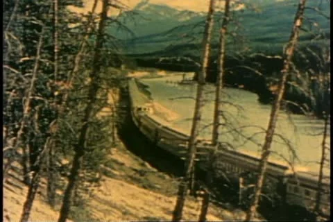 THE CANADIAN TRAIN, 1955, Streamliner train on curve in the Canadian Rockies Stock Footage 20477901