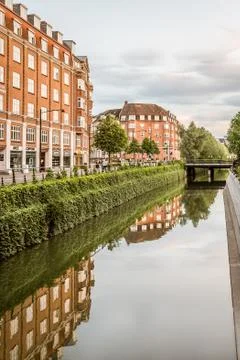 The canal in Aarhus flows gently through the city with space for copy Stock Photos