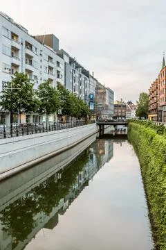 The canal in Aarhus flows gently through the city and buildings are reflectin Stock Photos