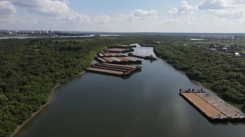 Canal with barges in Siberia Видео 137844686