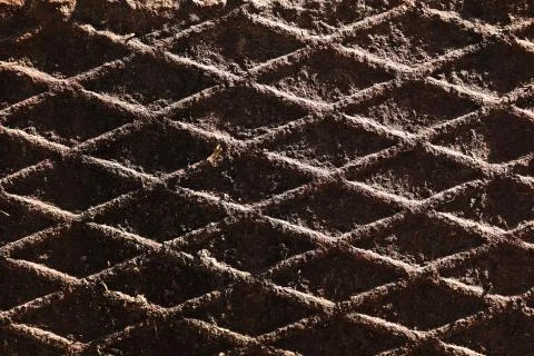 Canal cover surface texture. Rusty iron square pattern. Rusty metal square Stock Photos