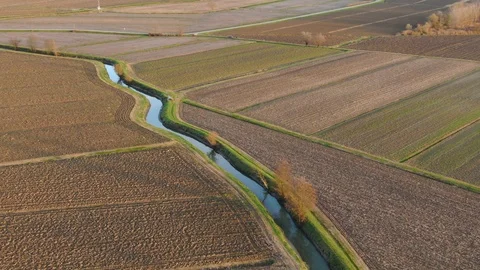 Canal in the fields at the sunset 스톡 동영상 121283478