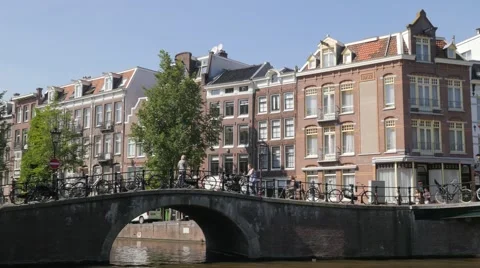 Canal houses with bridge and bicycles,Amsterdam,Netherlands Stock Footage
