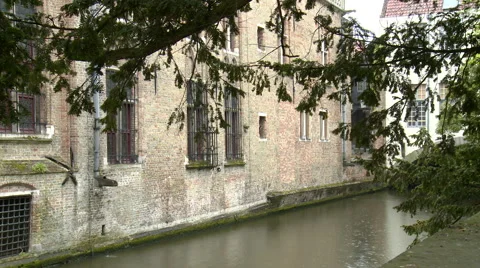 Canal by large brick building Stock Footage 55368255