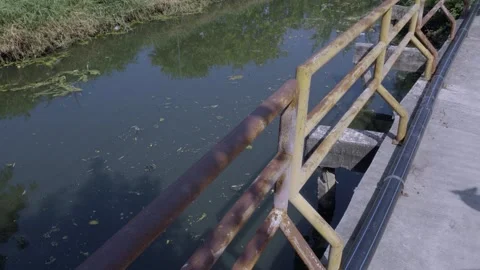 Canal Side Rusty Railing Perspective Video stock 338343156