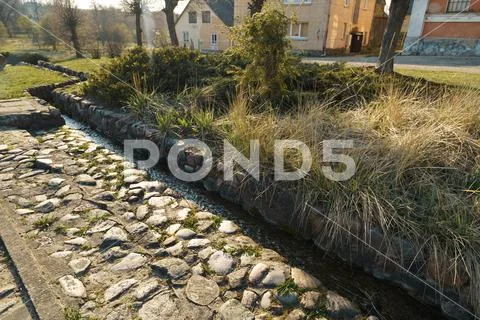 Canal with spring water in city Sabile in Latvia Stock Photos