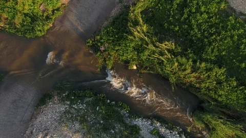 Canal streams over a road path Video stock 126944419