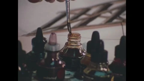 CANAL ZONE, PANAMA - 1972: Drafting - Dropper bottles sit on a painted map Vidéo 343939173