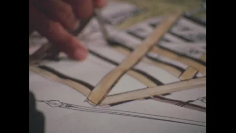 CANAL ZONE, PANAMA - 1972: Drafting - A fine pen runs a tan wooden strip Vidéo 343939183