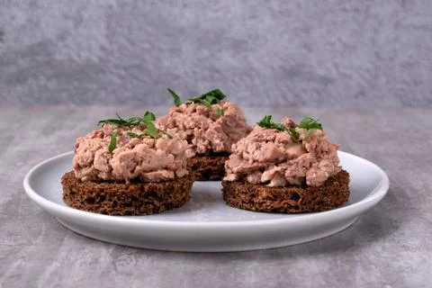 Canape with cod liver on brown bread 写真素材