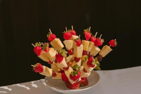 Canape of fruit on a skewer Stock Photos