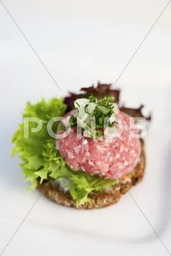 A canape with raw minced meat and onions Stock Photos