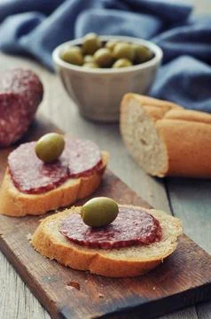 Canape with salami Stock Photos