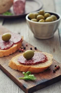 Canape with salami Stock Photos