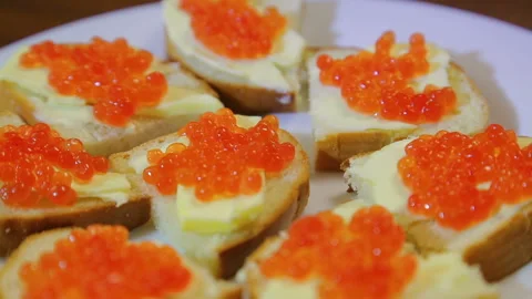 Canapes with red caviar on a white plate Stock Footage 103105296