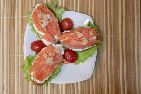 Canapes with salmon on brown background Stock Photos