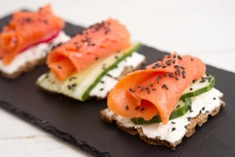 Canapes with salmon Stock Photos