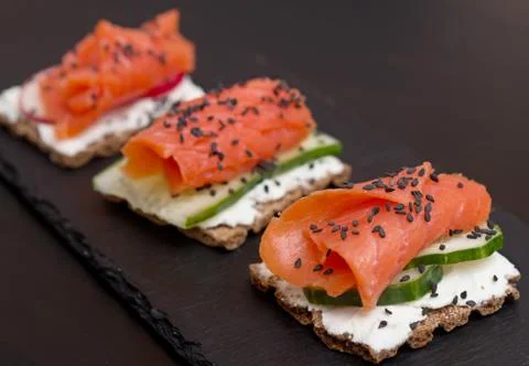 Canapes with salmon Stock Photos
