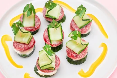 Canapes without Bread with Salami, Cucumber, Greens and Cream Cheese on Whi.. Stock Photos