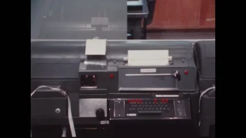 CANBERRA - 1970 - Men go over data printed at a NASA tracking station in Stock Footage 313208811