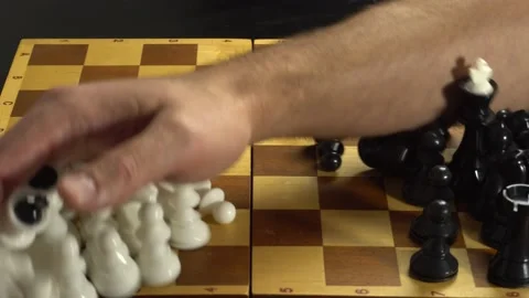 Canceling the game of chess, the man sweeps the hand of the figure off the board Stock Footage 142929158