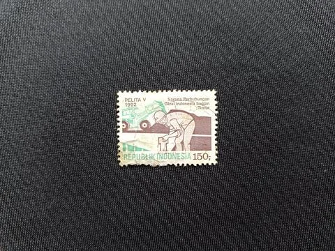 Cancelled Indonesian postal stamp worth 150 rupiah, Pelita V series. Circa 1992. Stock Photos