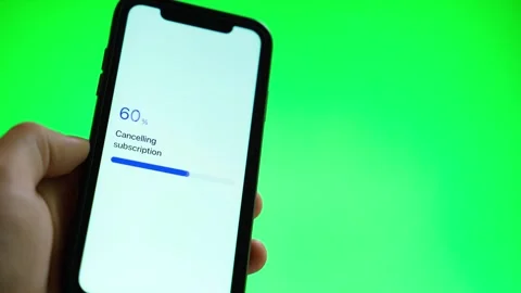 Cancelling subscription on smartphone screen against green background. Stock-Footage 342735434