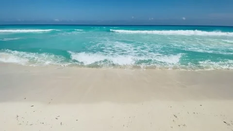 Cancun beach, light blue clear wavy sea and white sand, front view, Mexico Stock Footage 212479024