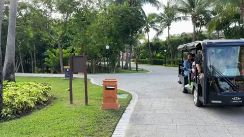 Cancun, Mexico; May 26, 2024: Golf cart transporting people inside the Bahia Stock Footage 281867892