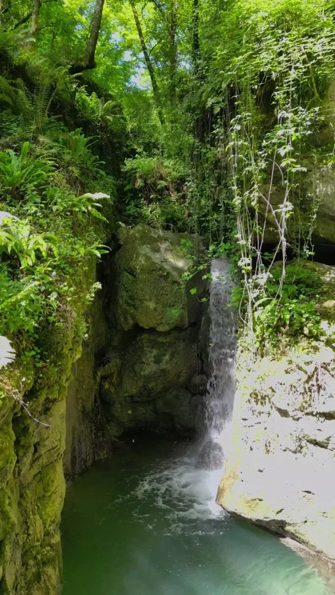 Candalla Falls Waterfall and Natural Pool Tuscany Italy Aerial Approach 4K Stock Footage 329054171