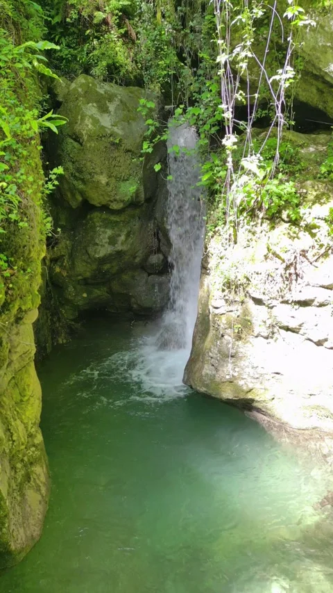 Candalla Falls Waterfall and Natural Pool Tuscany Italy Aerial Approach 4K Stock Footage 329054253