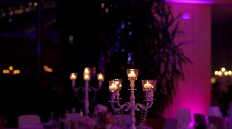 Candelabra with lighted candles in the evening in the hall Stock Footage 67659507