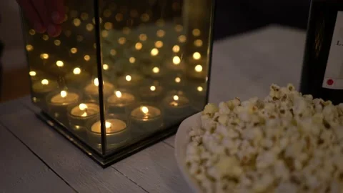 Candels on table with popcorn Stock Footage 147029660