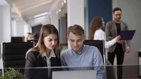 Candid creative busines man and woman discuss project in office Vídeo Stock 103109189