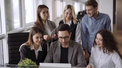 Candid creative busines team working in office and discussing start up ideas and Stock-Footage 103078728